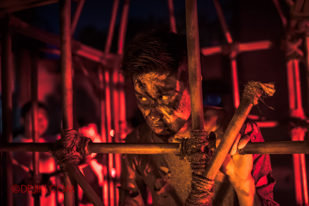 USS Singapore Halloween Horror Nights 8 Cannibal scare zone victim trapped in cage reginald