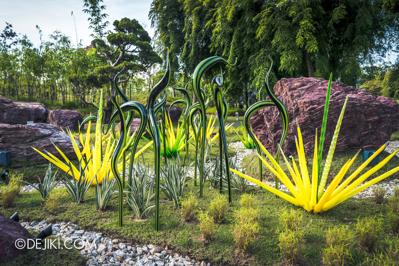 Gardens by the Bay Chihuly in Bloom Outdoor 06 Black and Green Striped Herons and Green Grass closeup