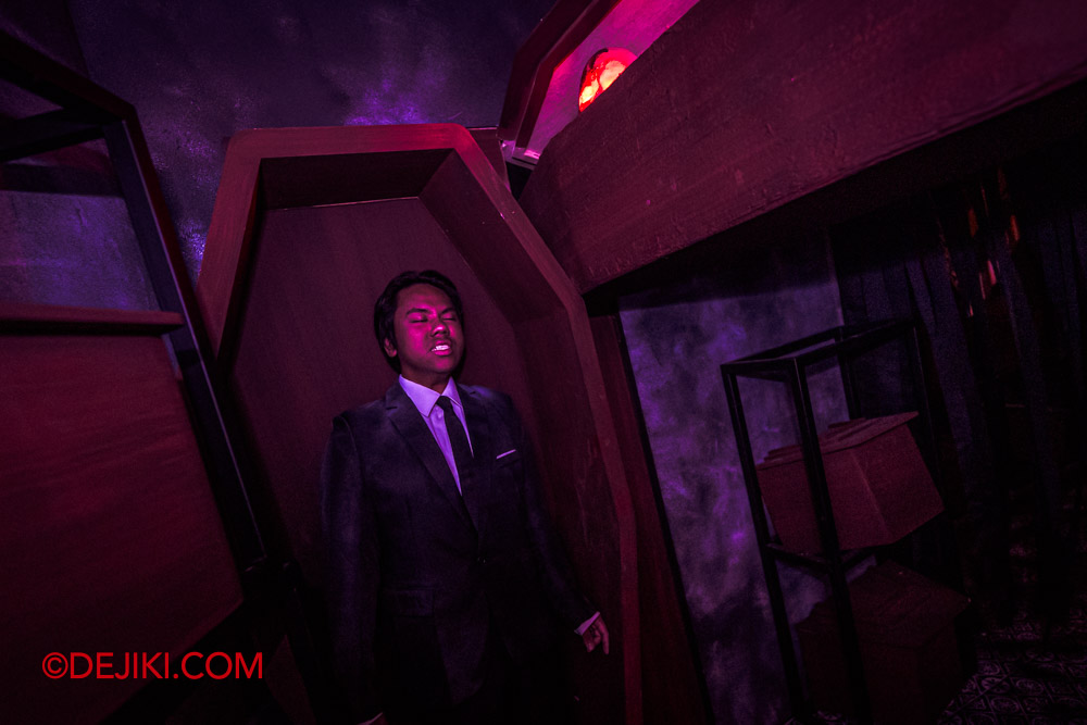 USS Halloween Horror Nights 11 Haunted Houses Feature by Dejiki Rebirth of the Matriarch 7 Casket Room Victim Man in Suit
