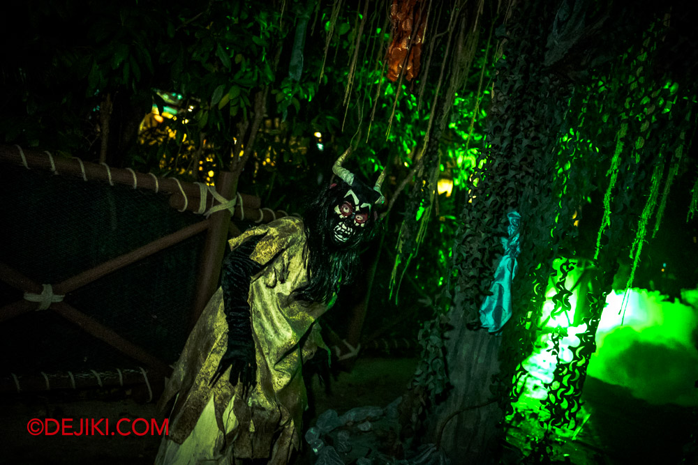 USS Halloween Horror Nights 11 Scare Zones Feature by Dejiki The Cursed Kiramam 4 green mask demon after tree stilts