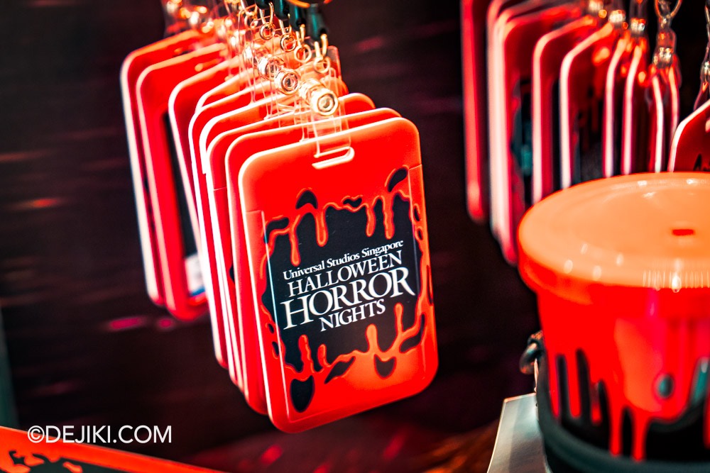 USS Halloween Horror Nights 12 Before Dark by Dejiki HHN12 merchandise display at Universal Studios Store Lanyard with hard cardholder