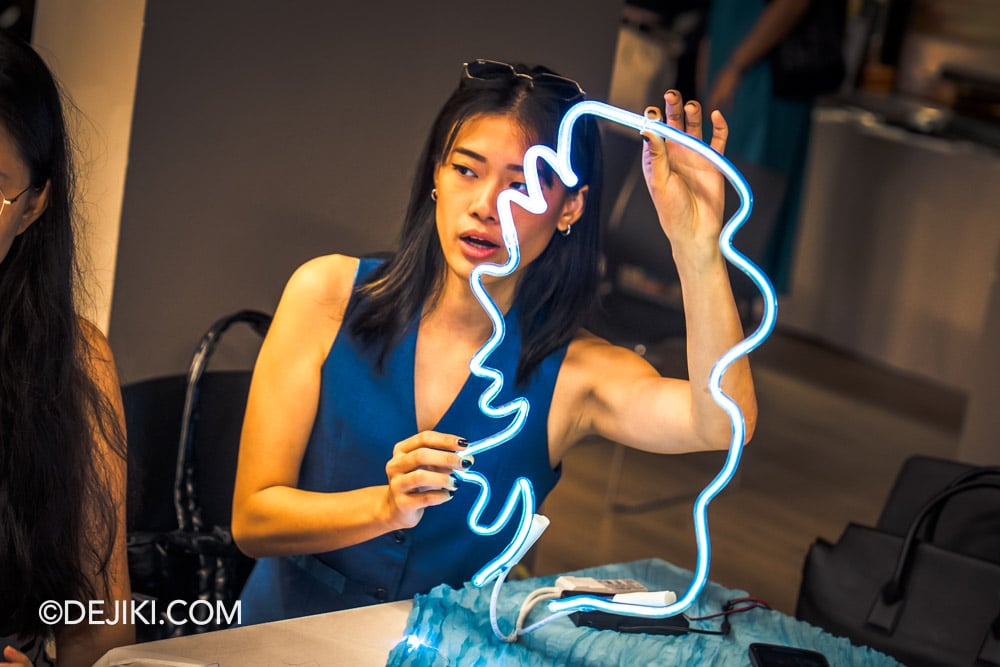Singapore Night Festival 2025 Artist Maegszter Megan Foo offering a demonstration of the neon light tube