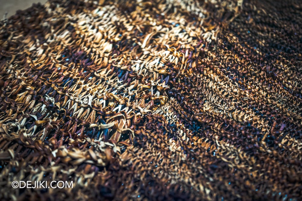 Singapore Art Museum SAM 2025 The Living Room exhibition Knitting the future by Chia Chuyia leek garment closeup showing weathered fragility