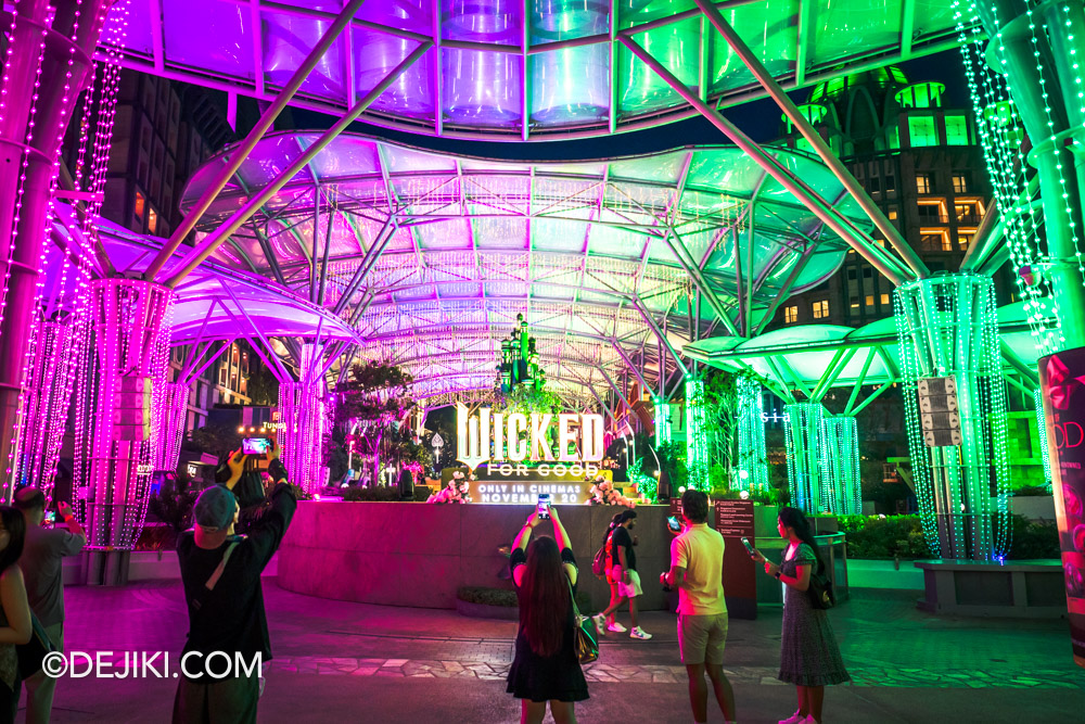 Universal Studios Singapore 2025 Wicked For Good event Discover Your Good at Sentosa RWS Lake of Dreams Exterior Lights in Pink and Green