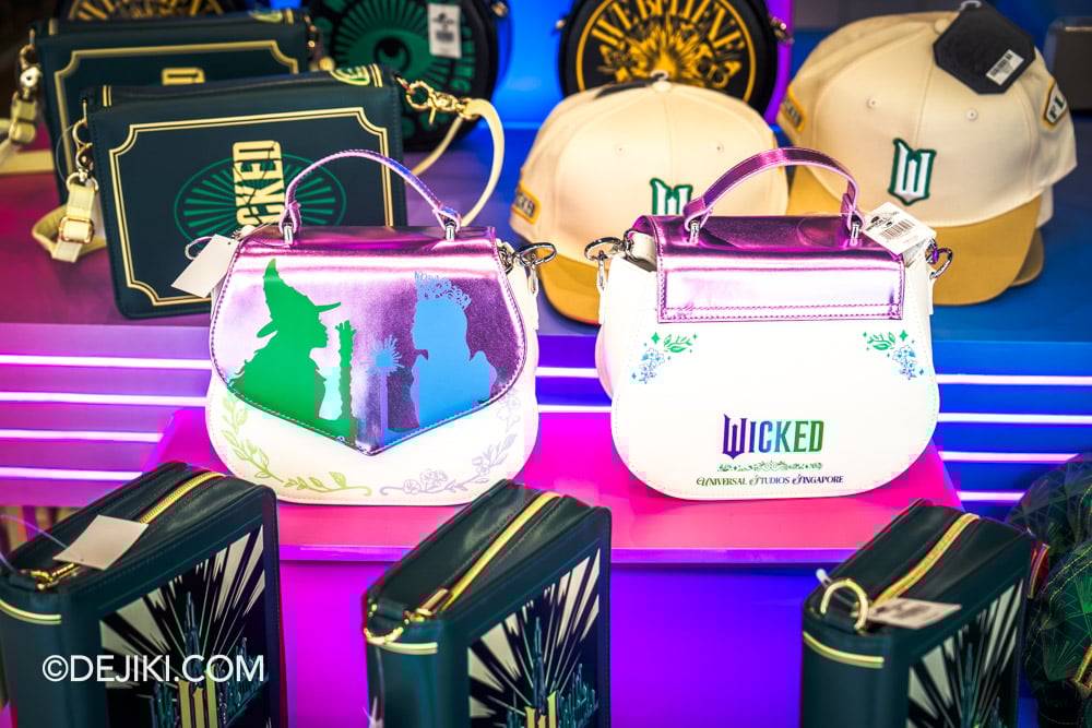 Universal Studios Singapore 2025 Wicked For Good event - Silver Screen Store with Wicked merchandise closeup pink purse Universal Studios Singapore 2025 Wicked For Good event Silver Screen Store with Wicked merchandise closeup pink purse