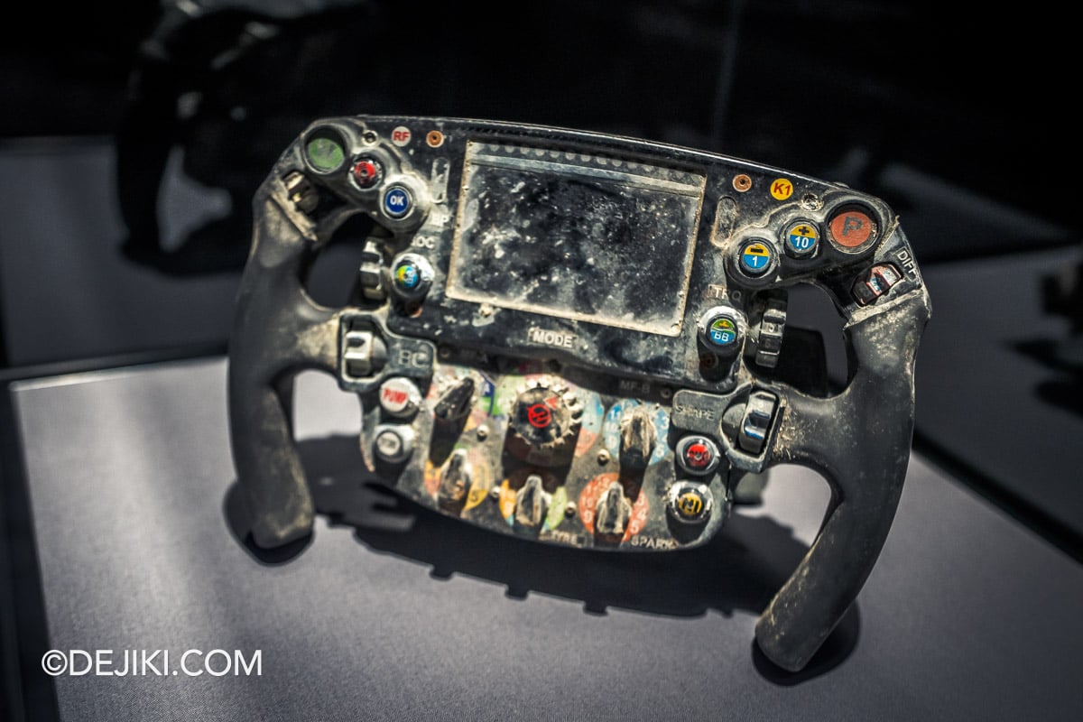 F1 The Exhibition Singapore - 7 Survival Charred Steering Wheel F1 The Exhibition Singapore 7 Survival Charred Steering Wheel