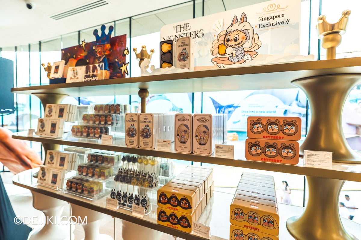 POP BAKERY Singapore at Resorts World Sentosa - Cafe Retail Section with Biscuit Tins and Chocolates for Takeaway Retail shelves at POP BAKERY stocked with character biscuit tins and moulded chocolates for takeaway