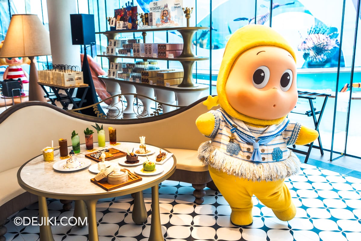 POP BAKERY Singapore at Resorts World Sentosa - Hero image with Twinkle Twinkle meet and greet Twinkle Twinkle mascot beside a table of POP BAKERY desserts and drinks during a Meet and Greet