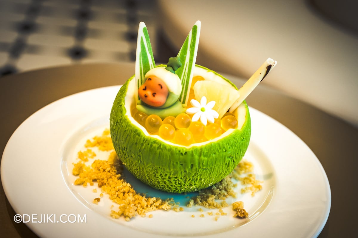 POP BAKERY Singapore at Resorts World Sentosa - Menu Showcase Twinkle Twinkle Tangy Coconut Mousse closeup Twinkle Twinkle Tangy Coconut Mousse in a green chocolate coconut shell, topped with passionfruit popping boba