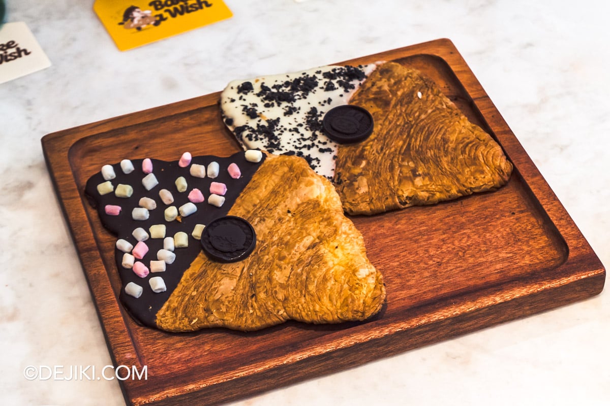 POP BAKERY Singapore at Resorts World Sentosa - Menu showcase DIMOO LABUBU crispy flat croissants DIMOO and LABUBU Crispy Flat Croissants, finished in dark and white chocolate