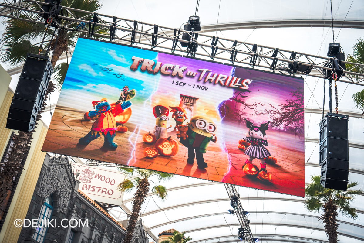 Universal Studios Singapore Day Halloween Trick or Thrills 2026 Key visual on overhead screen at Hollywood Boulevard street
